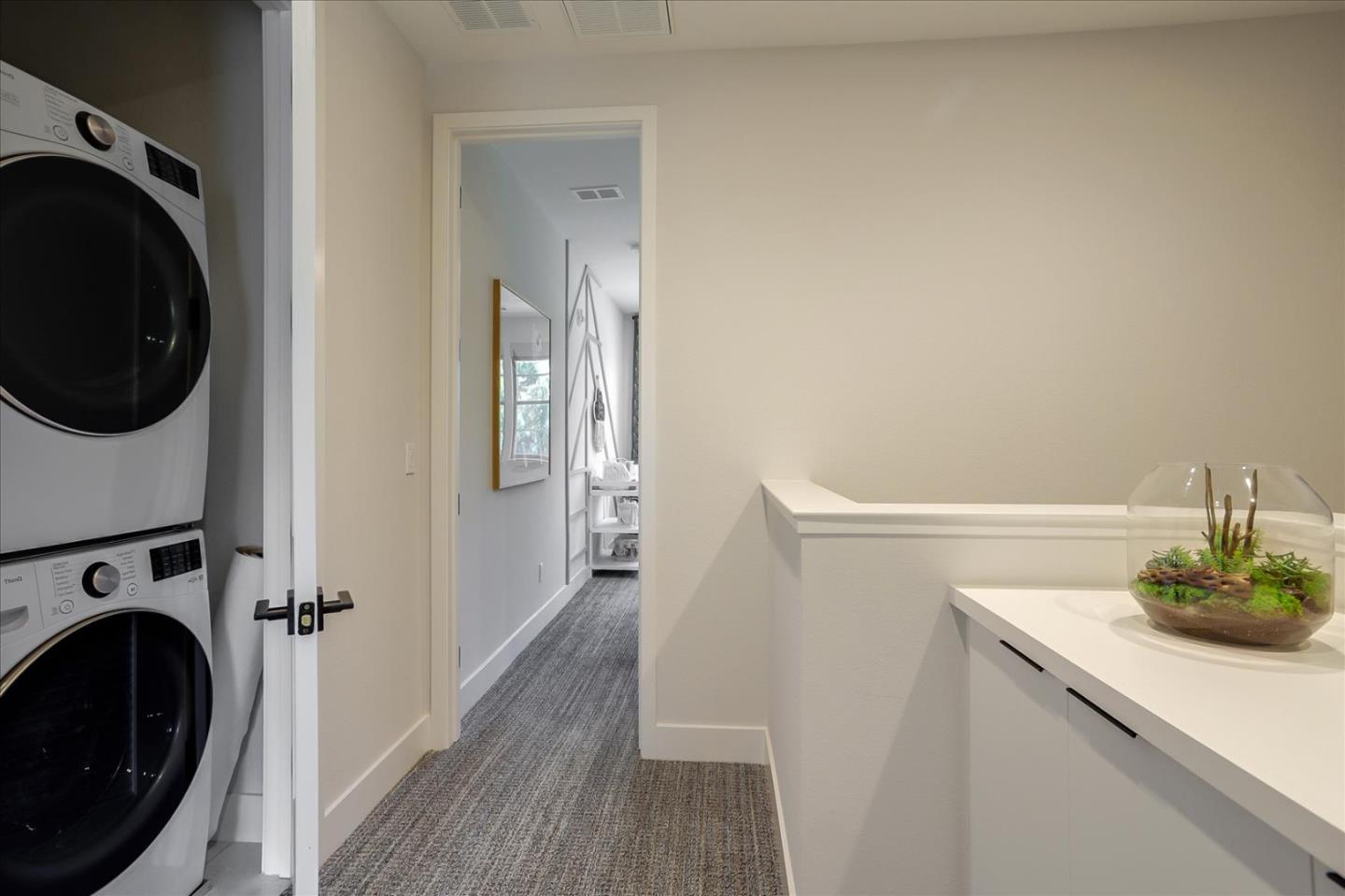 1323 West Middlefield Road Mountain View, CA 94043 - Photo 26 of 30 a view of a hallway with washer and dryer