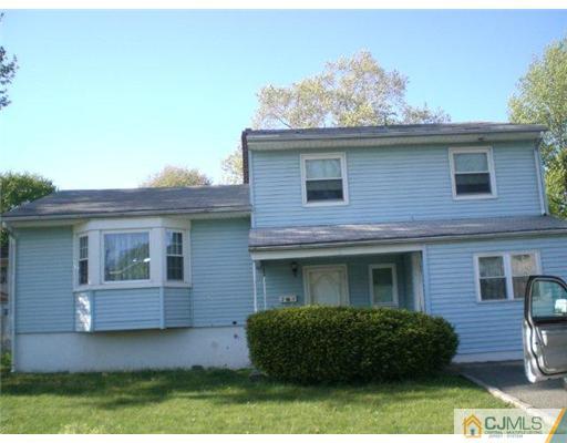 23 Sulliman Road Edison, NJ 08817 - Photo 1 of 1 a front view of a house with a garden