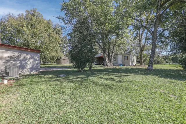 a view of outdoor space with deck and tree
