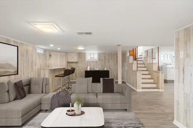 a view of a house with backyard sitting area and swimming pool