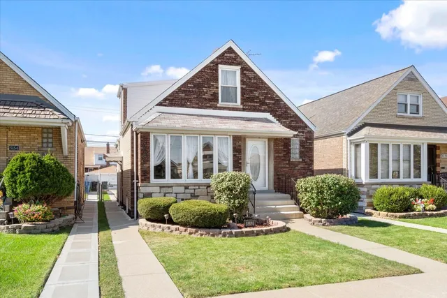 a view of a house with backyard sitting area and swimming pool