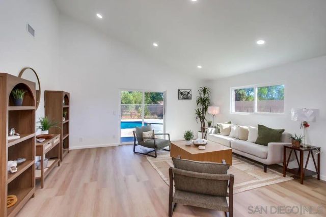 a bathroom with a double vanity sink mirror and toilet