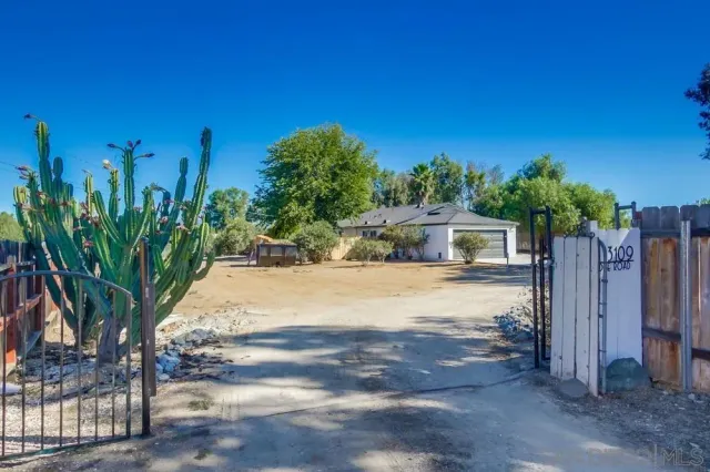 a very nice looking dining room with furniture