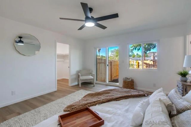 a view of backyard with swimming pool and outdoor seating