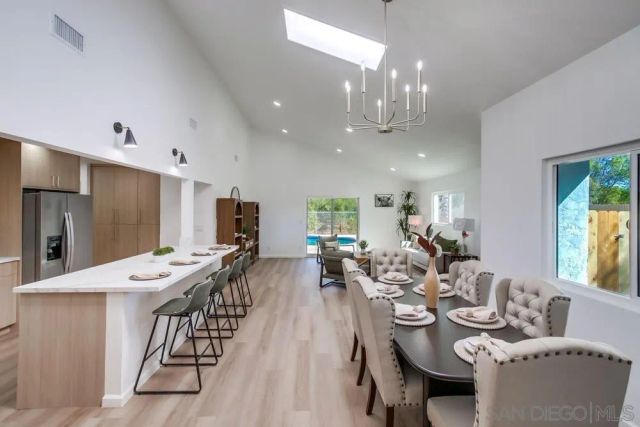 a kitchen with a dining table and chairs