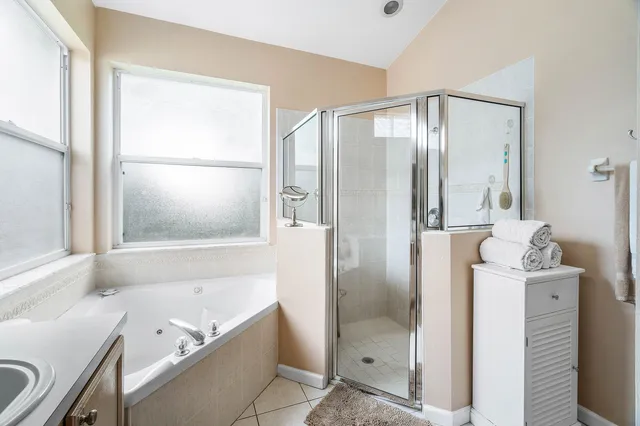 a bathroom with a bathtub and a shower
