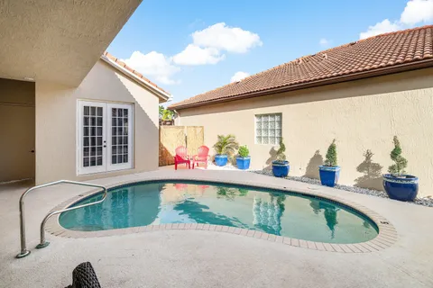 a view of swimming pool from a balcony