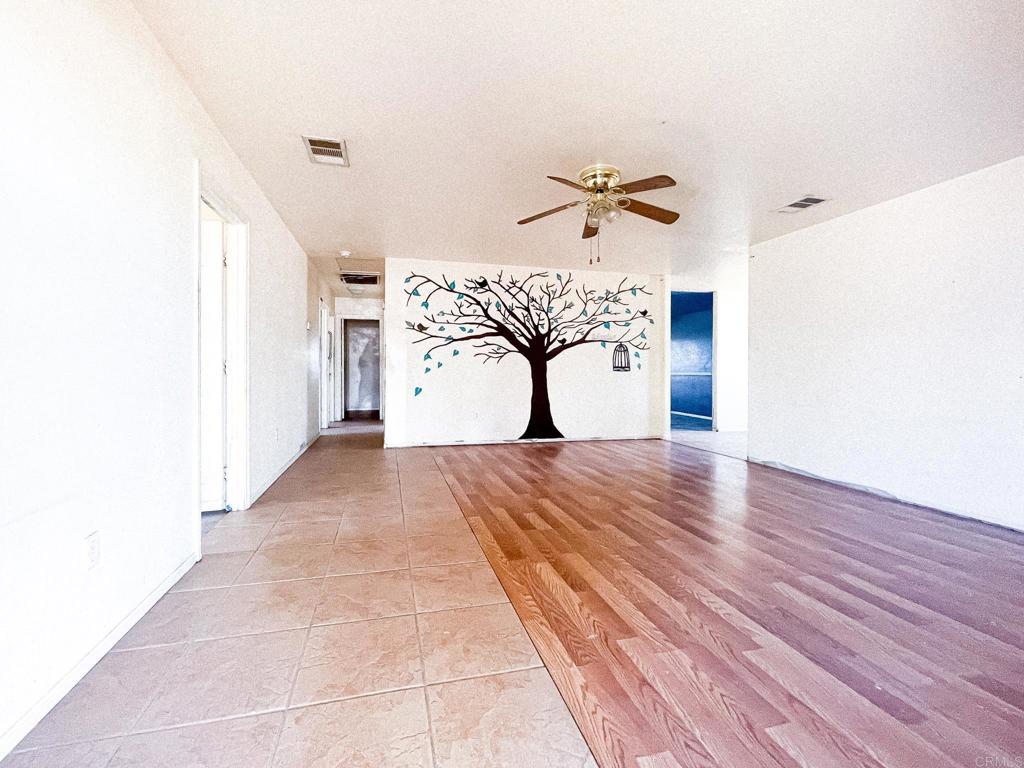 531 Lee Road Imperial, CA 92251 - Photo 7 of 18 a view of a room with wooden floor and ceiling fan