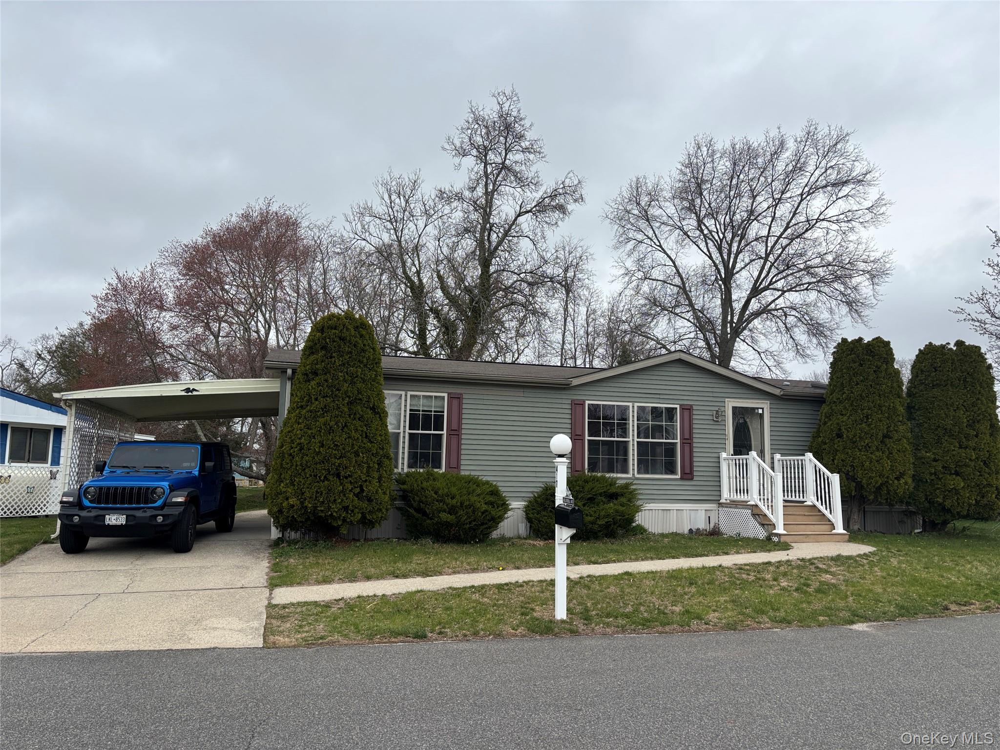 a car parked in front of white house