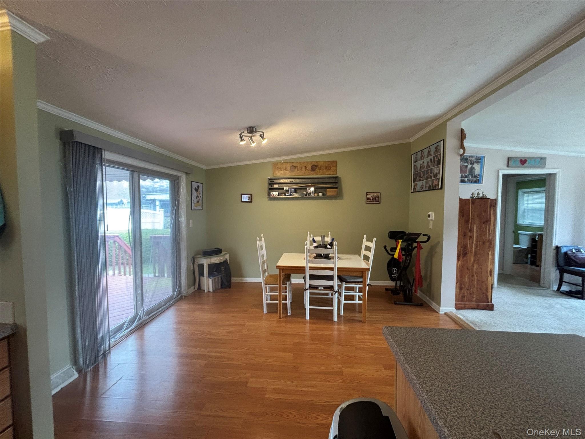 1661 Old Country Road, Unit 417 Riverhead, NY 11901 - Photo 12 of 20 a view of a livingroom with furniture and window