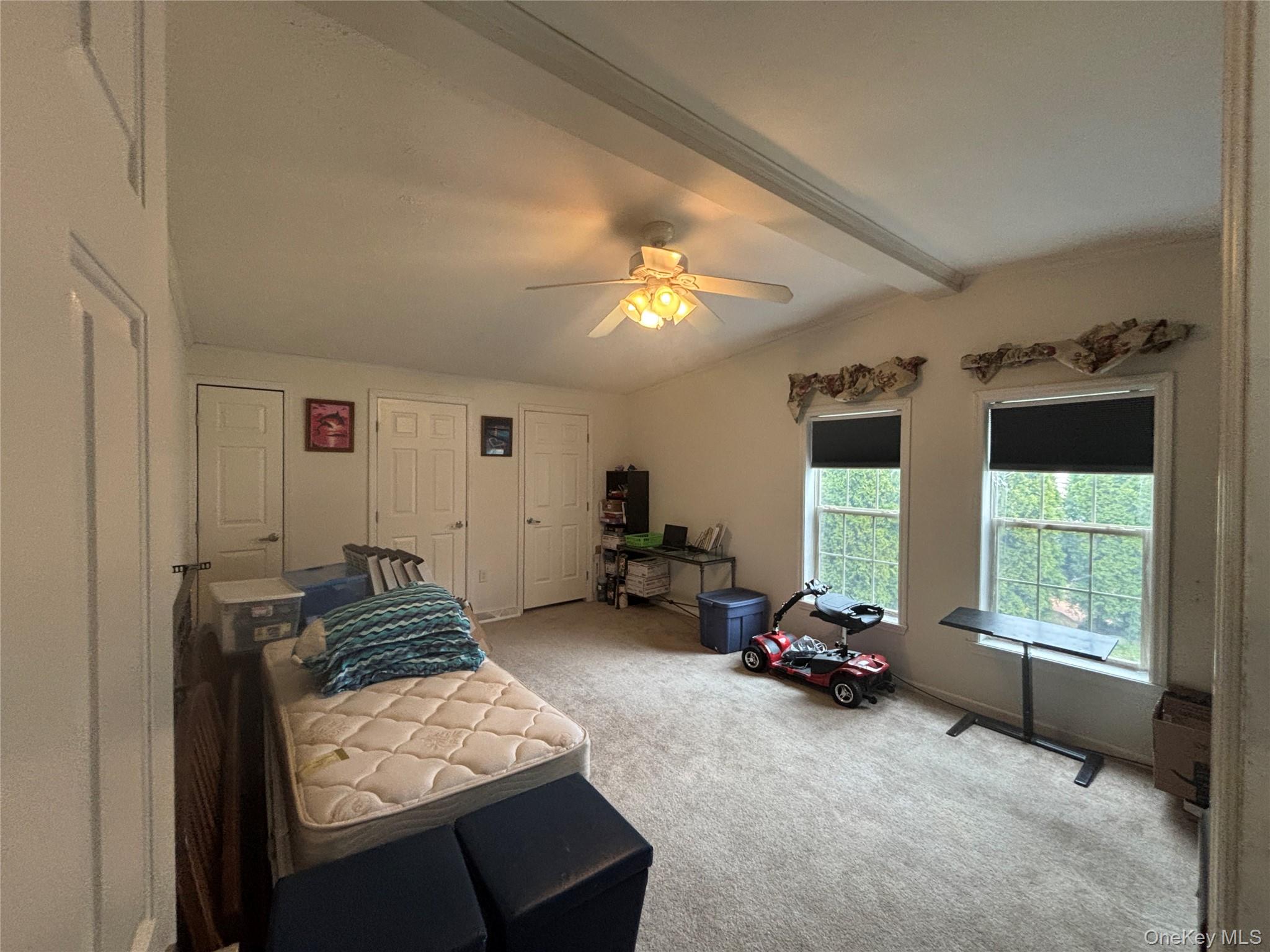 1661 Old Country Road, Unit 417 Riverhead, NY 11901 - Photo 18 of 20 a living room with furniture and a large window