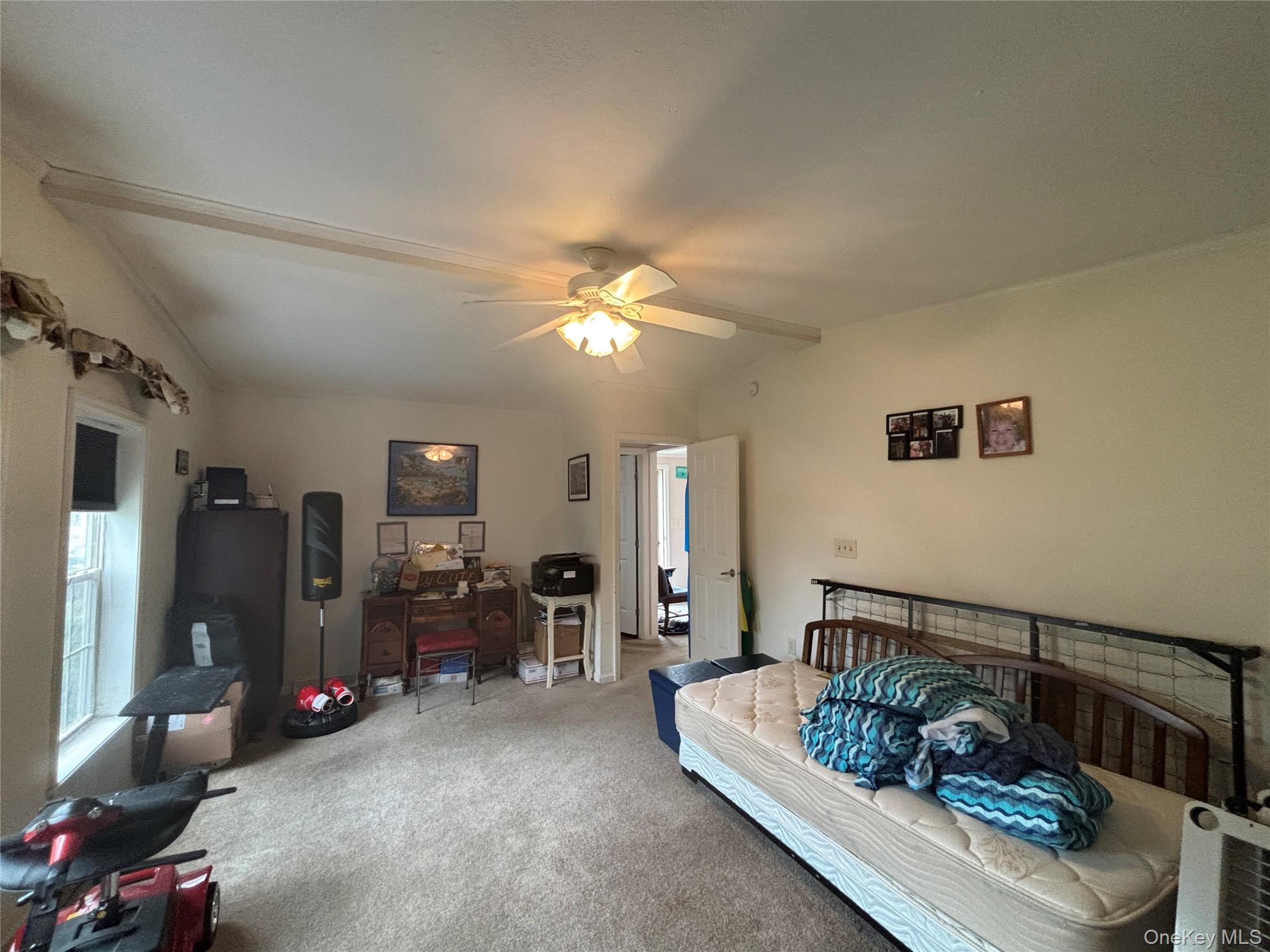 1661 Old Country Road, Unit 417 Riverhead, NY 11901 - Photo 19 of 20 a living room with furniture and a chandelier