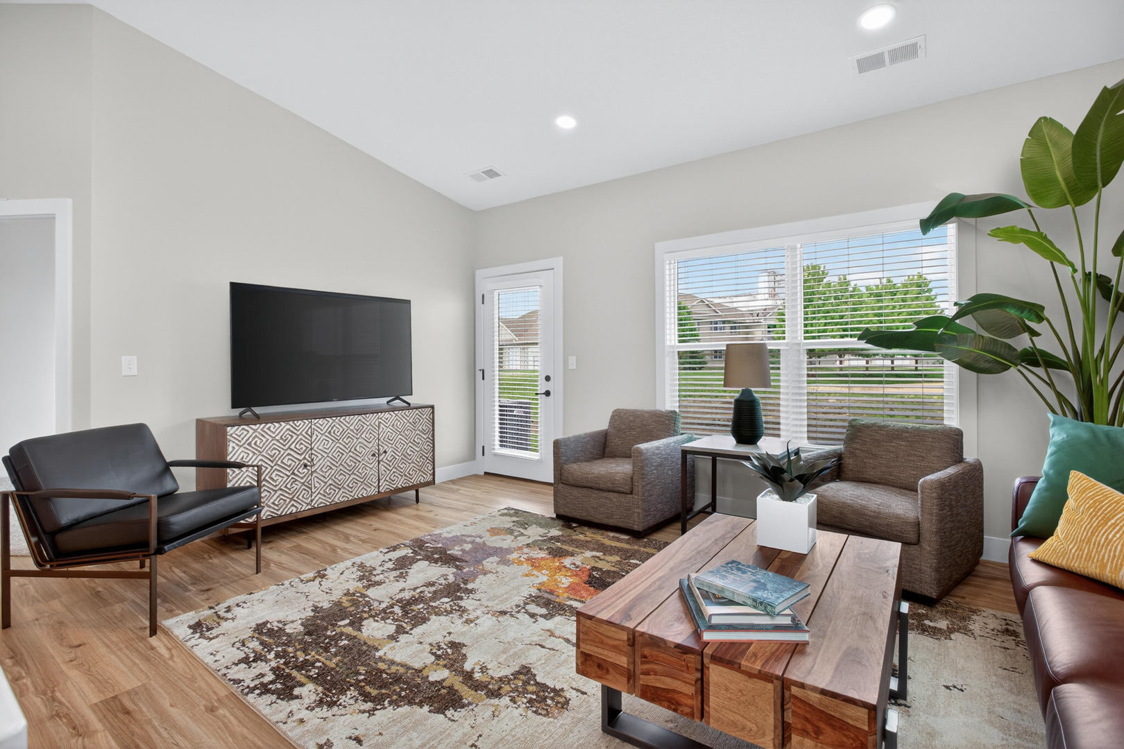 412 North 2nd Street Eldridge, IA 52748 - Photo 15 of 30 a living room with furniture and a flat screen tv