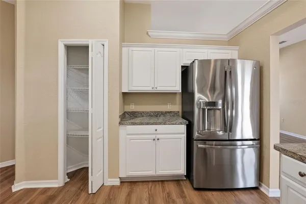 a kitchen with cabinets and stainless steel appliances
