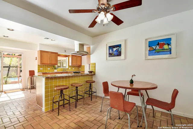 a dining room with furniture and window