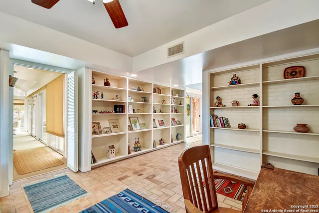a view of a livingroom with shelves