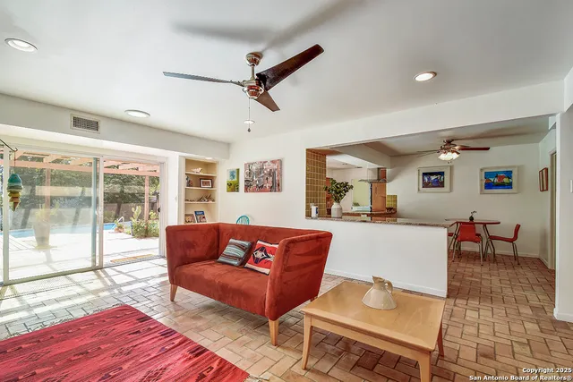 a living room with furniture and a table