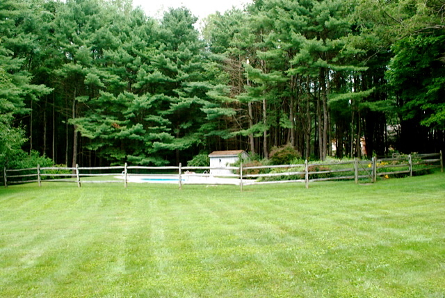12 Old Tree Farm Road Stockbridge, MA 01266 - Photo 15 of 18 a swimming pool with lots of trees in the background