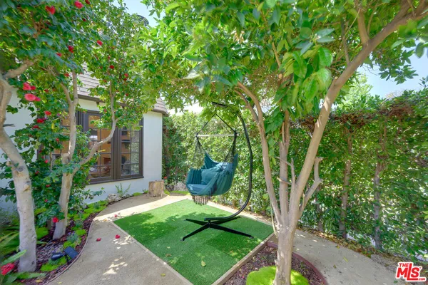 a view of a backyard with garden