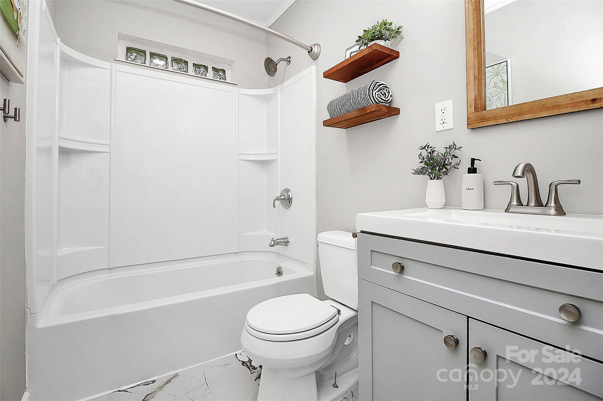 319 Gold Hill Road Fort Mill, SC 29715 - Photo 17 of 28 a bathroom with a sink vanity mirror and toilet