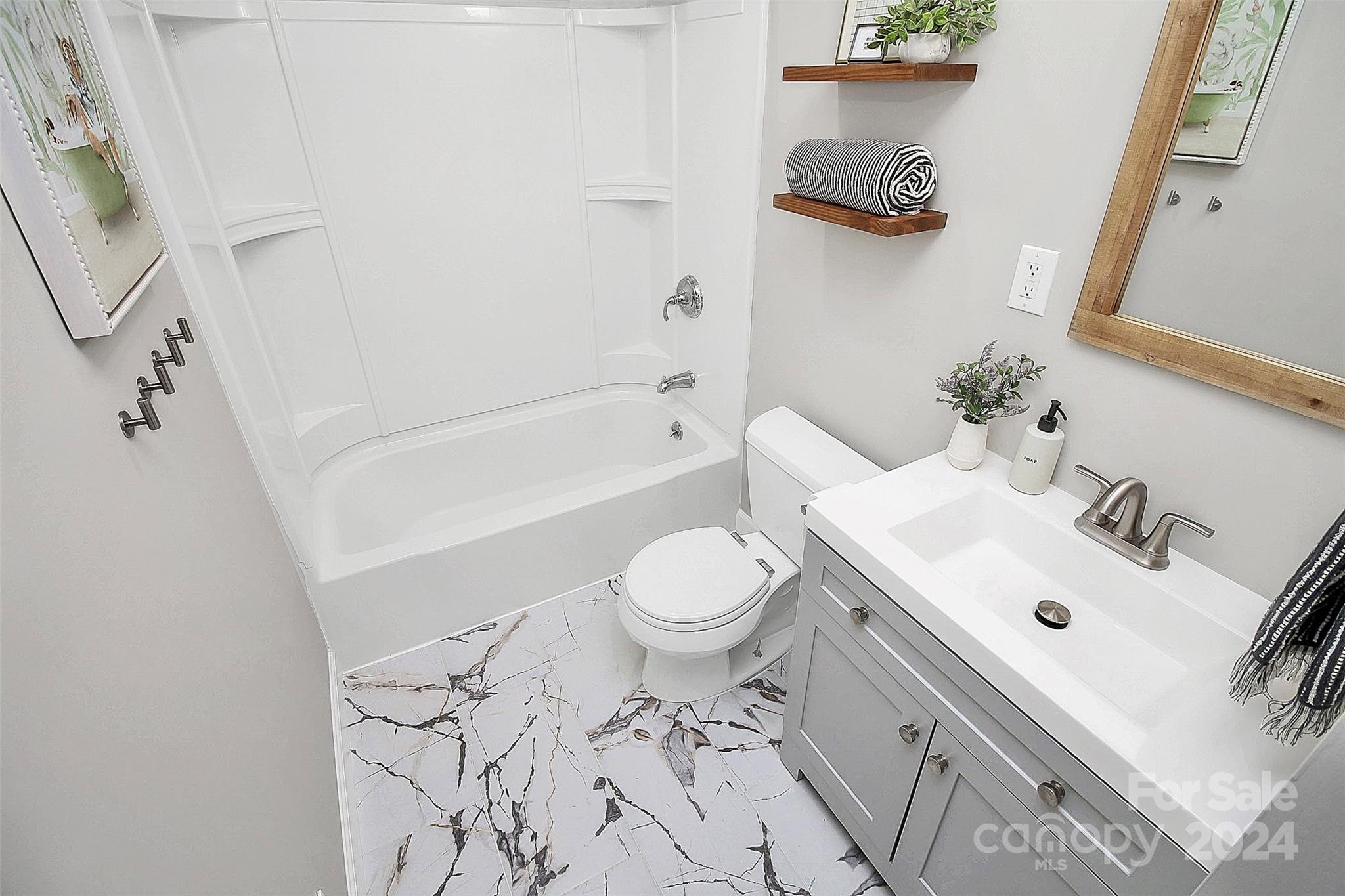 319 Gold Hill Road Fort Mill, SC 29715 - Photo 18 of 28 a bathroom with a sink toilet and shower