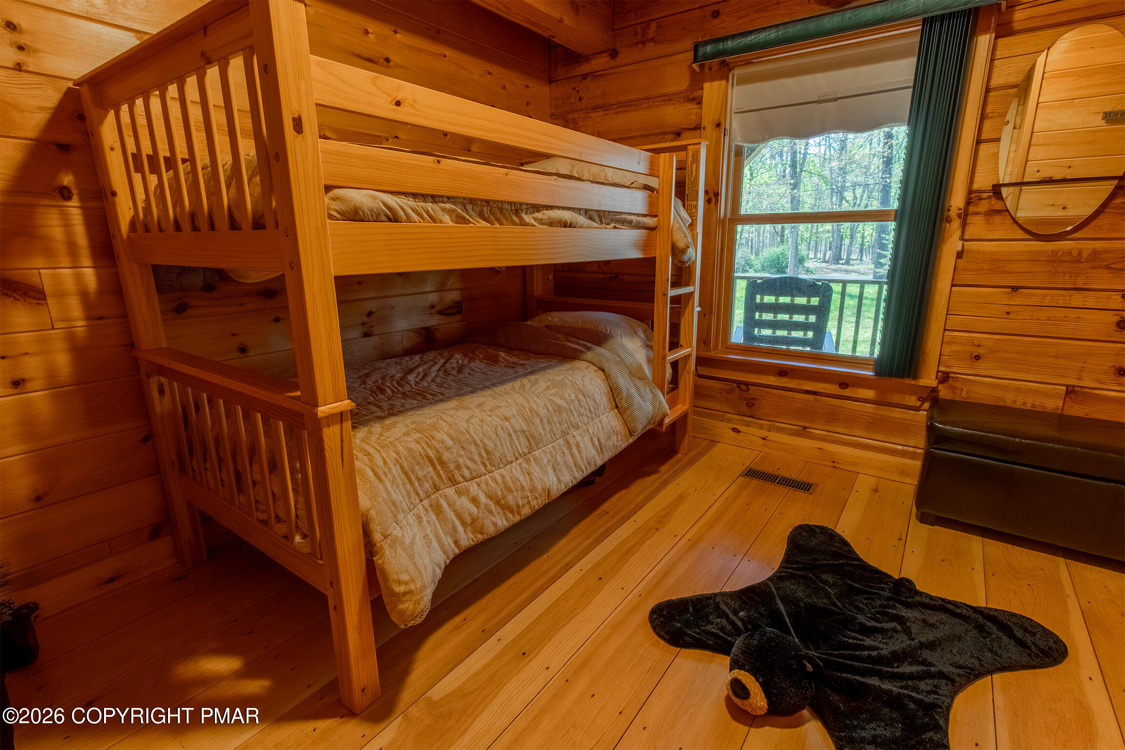 1160 Bluebird Lane Bushkill, PA 18324 - Photo 22 of 44 a bed sitting in a bedroom next to a window