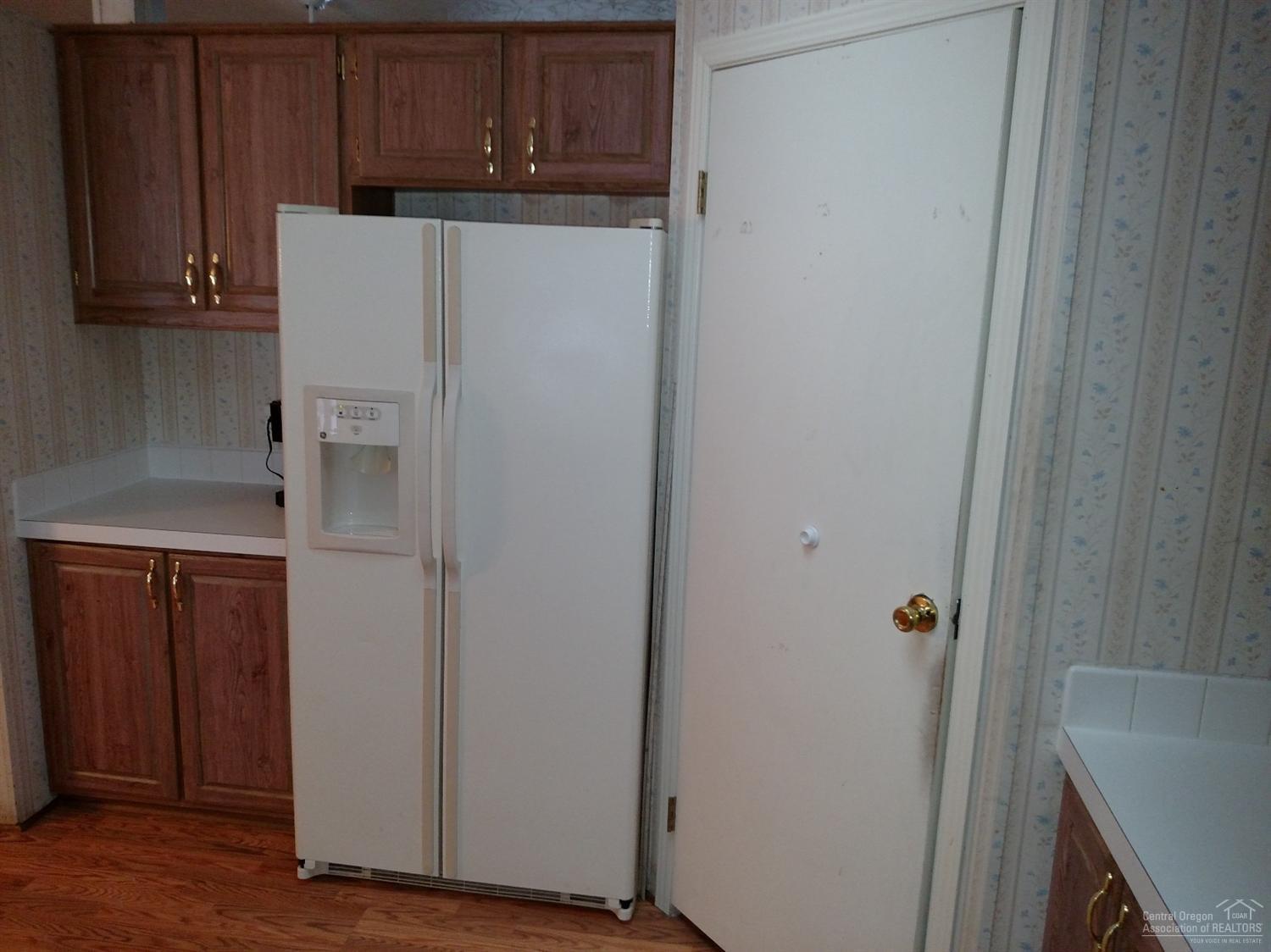 18920 Choctaw Road Bend, OR 97702 - Photo 3 of 15 a white refrigerator freezer sitting inside of a kitchen