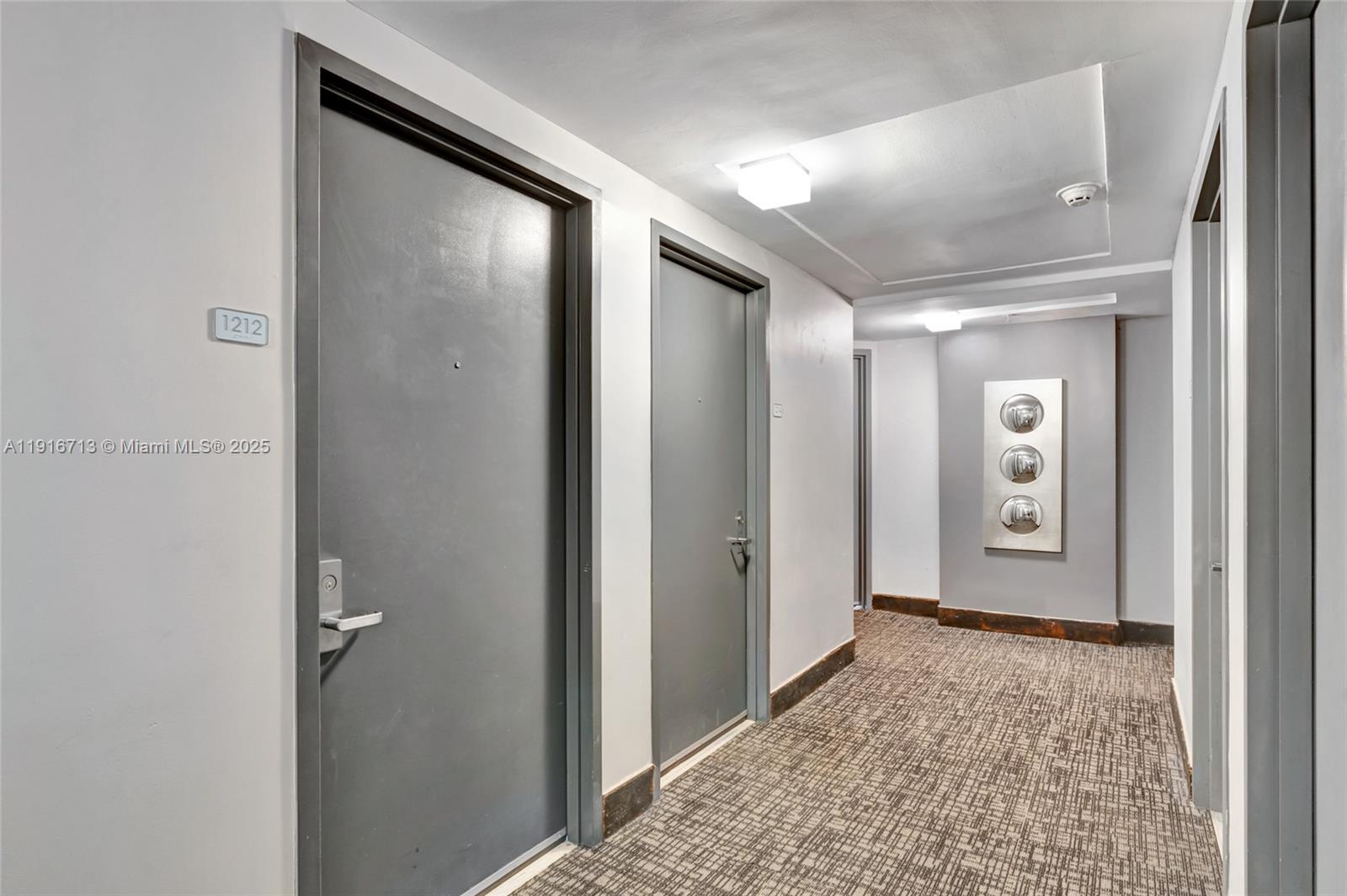 41 Southeast 5th Street, Unit 1212 Miami, FL 33131 - Photo 20 of 37 a view of room with window and hallway