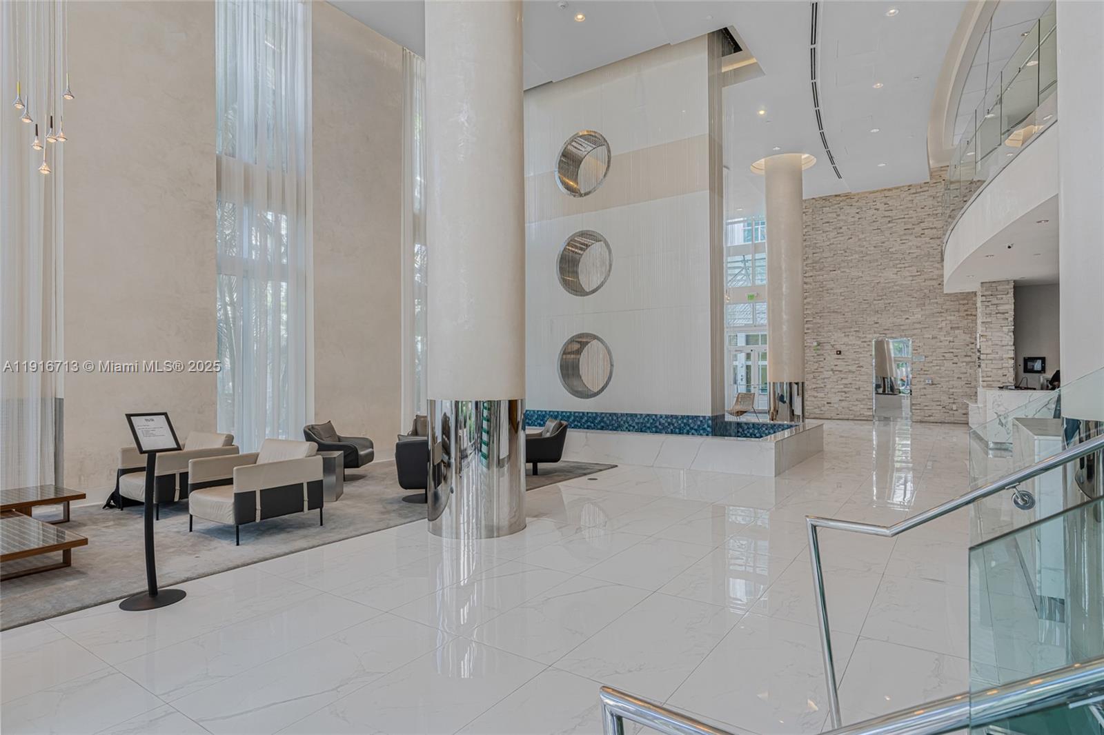 41 Southeast 5th Street, Unit 1212 Miami, FL 33131 - Photo 22 of 37 a very nice looking room with a couch