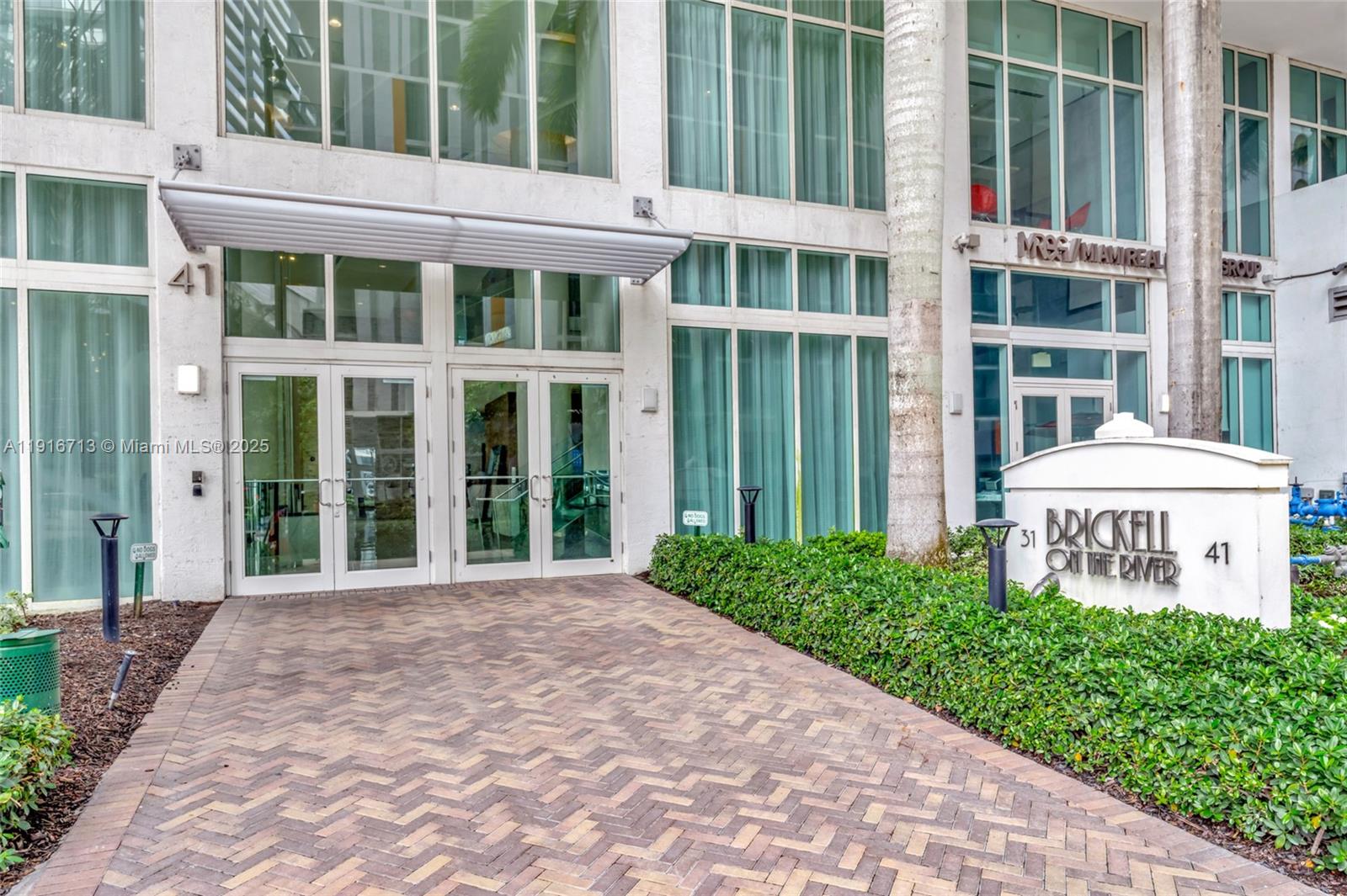 41 Southeast 5th Street, Unit 1212 Miami, FL 33131 - Photo 26 of 37 a view of a brick building next to a yard