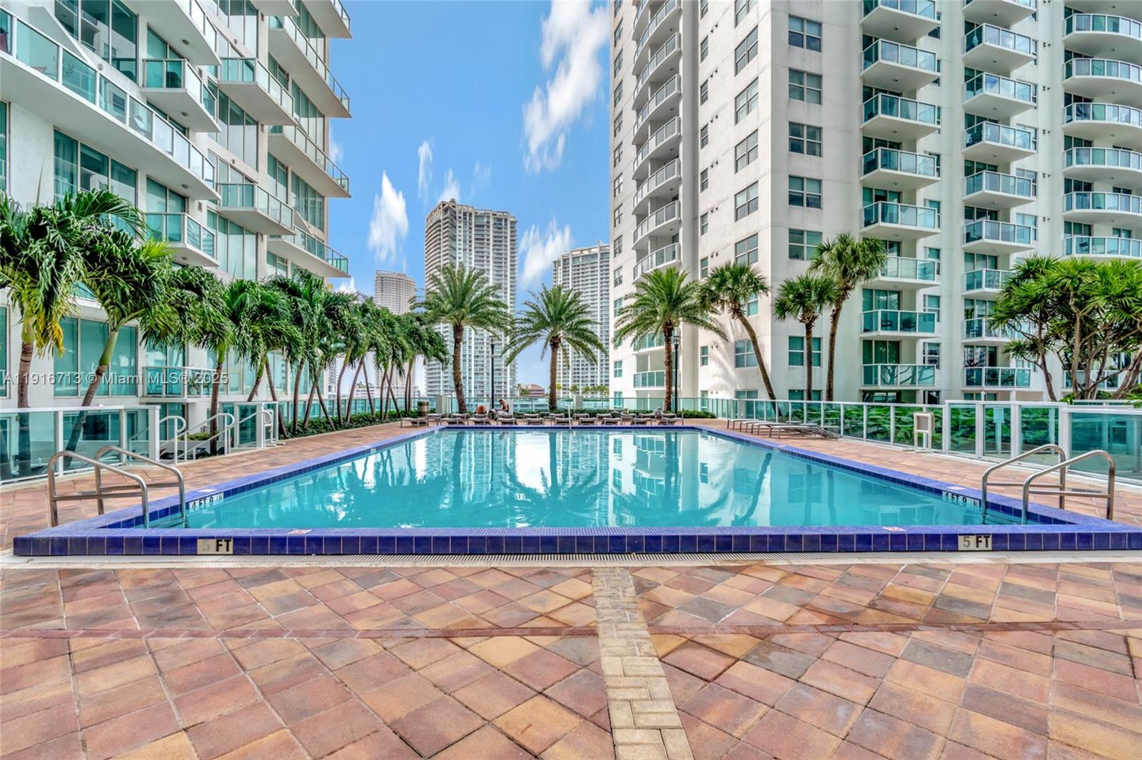 41 Southeast 5th Street, Unit 1212 Miami, FL 33131 - Photo 27 of 37 a view of a swimming pool with a patio