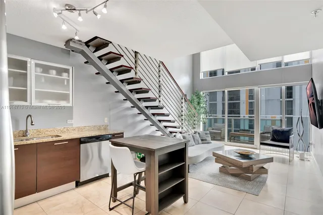 a living room with granite countertop furniture and a potted plant