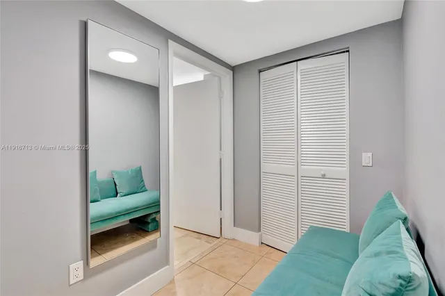 a bed room with a bed and a chair