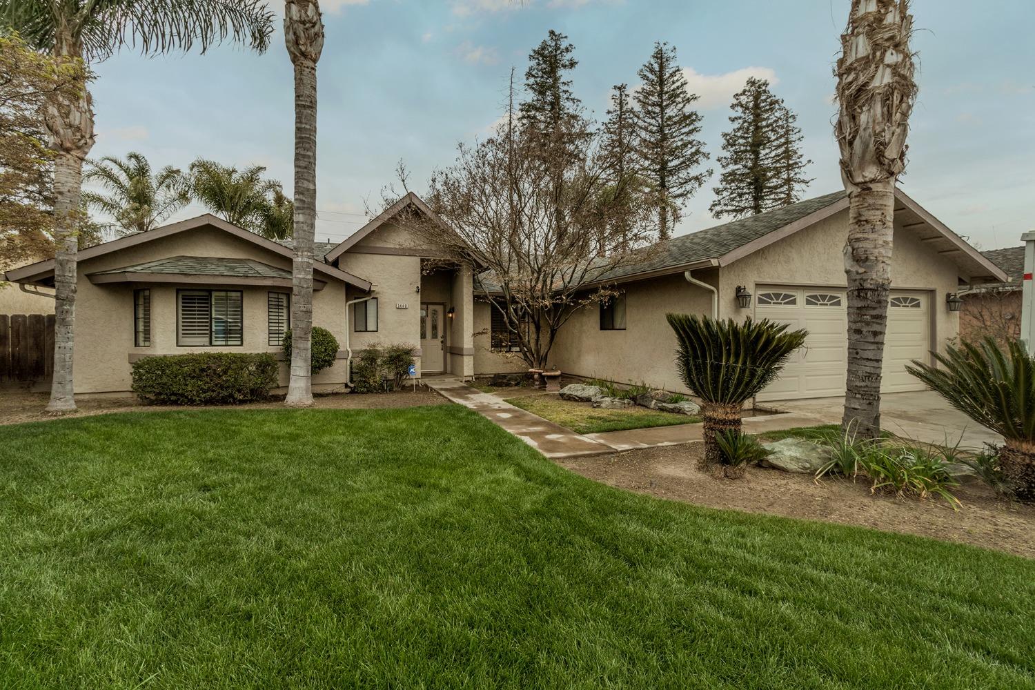 3440 Olive Street Selma, CA 93662 - Photo 1 of 21 a front view of a house with a garden