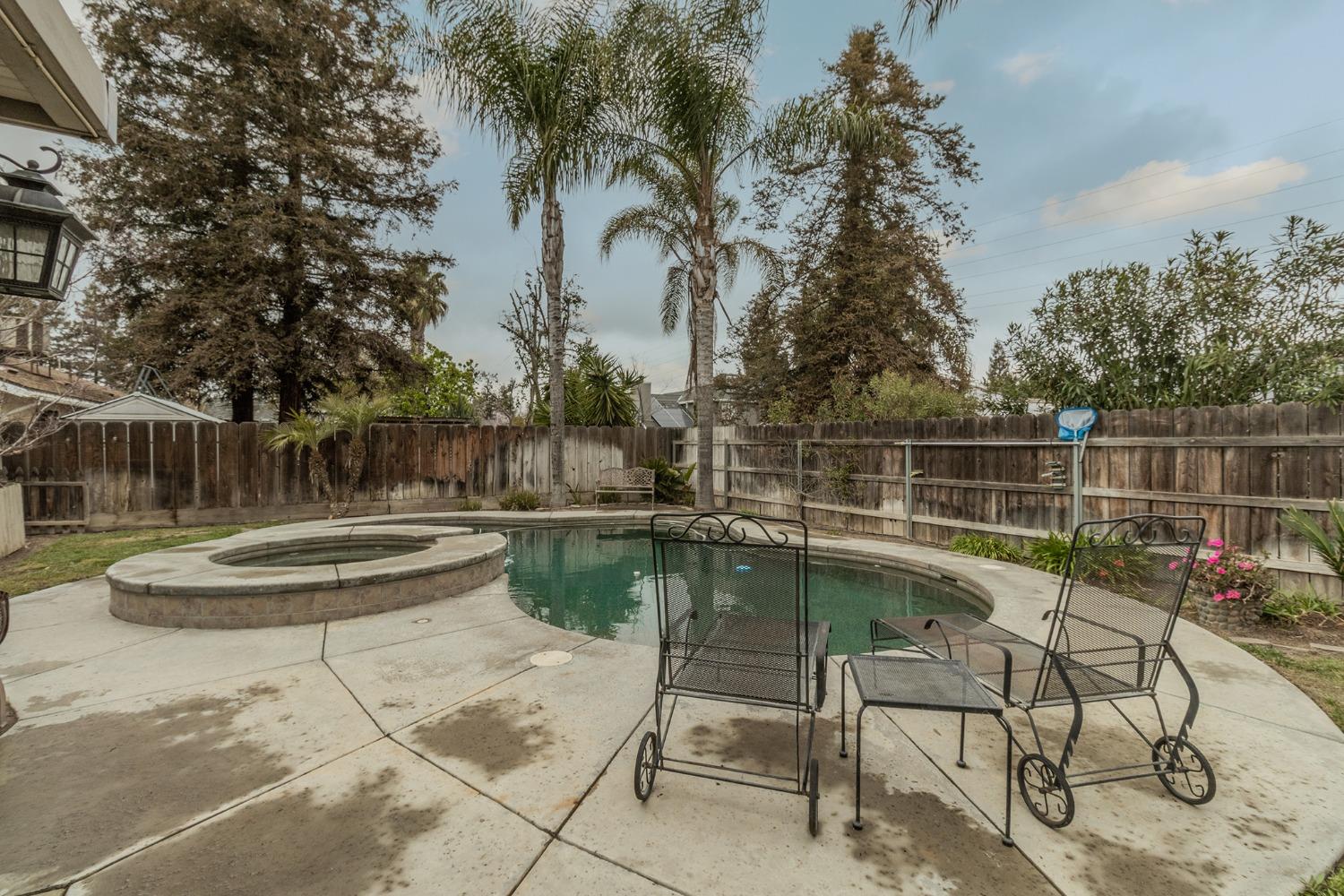3440 Olive Street Selma, CA 93662 - Photo 18 of 21 a view of a swimming pool with a lounge chair