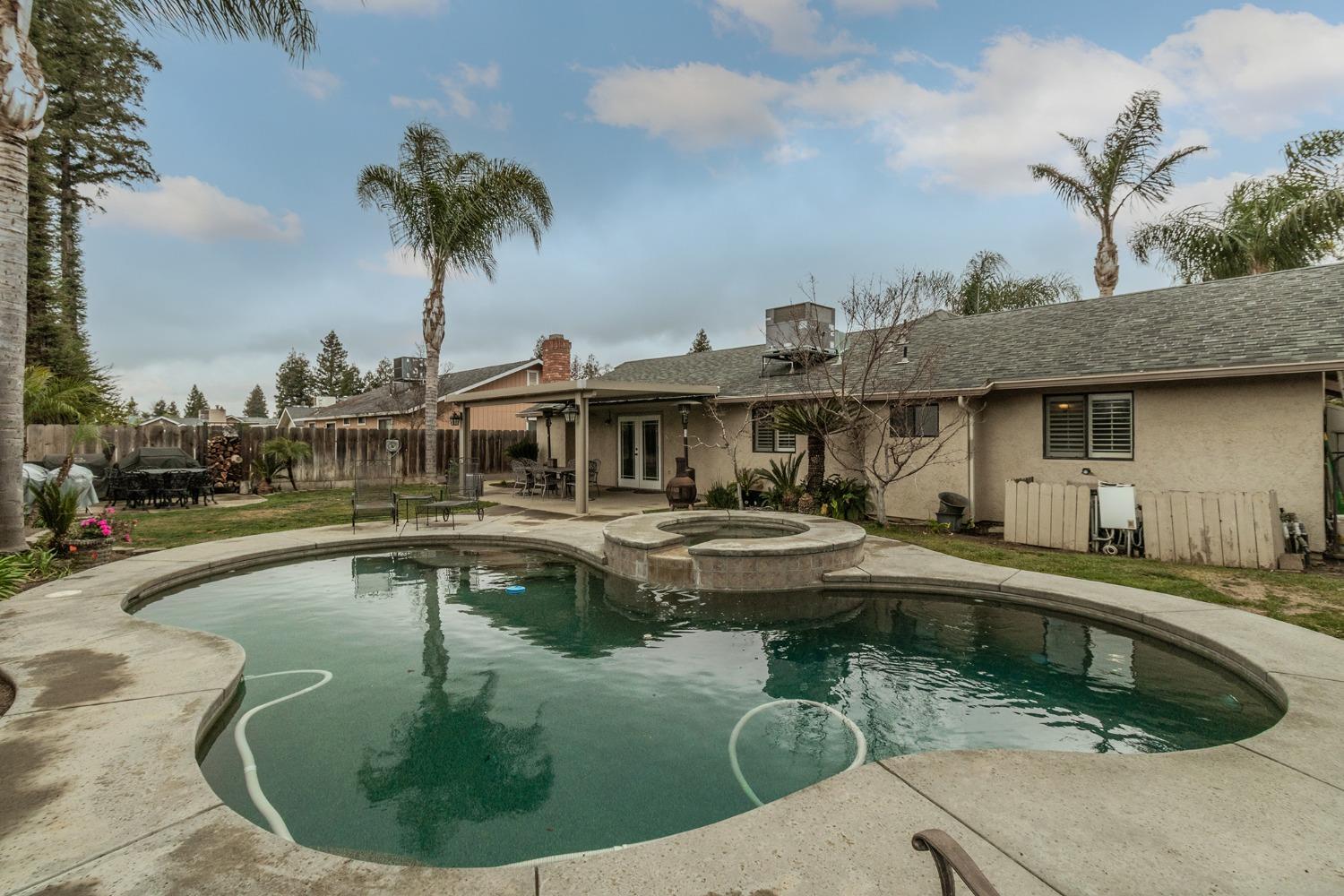 3440 Olive Street Selma, CA 93662 - Photo 19 of 21 a view of a house with swimming pool and sitting area