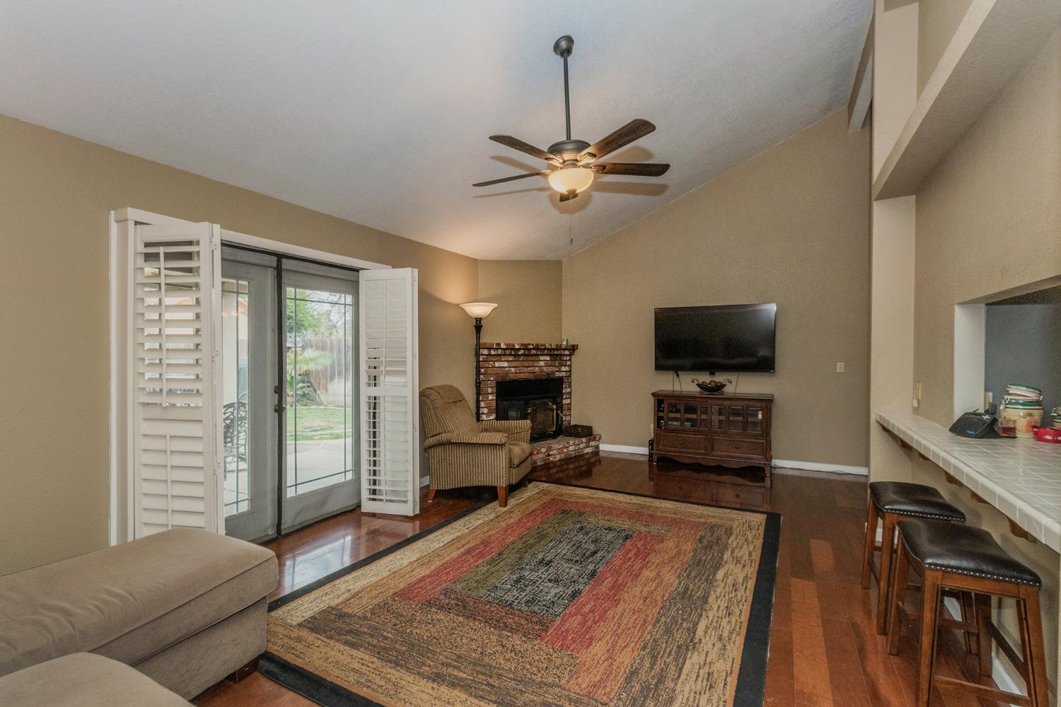 3440 Olive Street Selma, CA 93662 - Photo 3 of 21 a living room with furniture and a flat screen tv