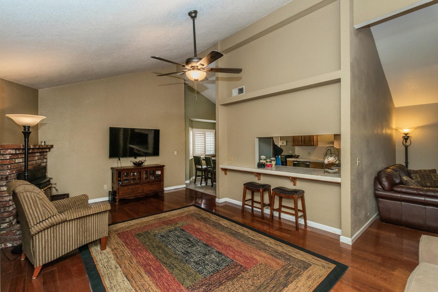 3440 Olive Street Selma, CA 93662 - Photo 4 of 21 a living room with furniture and a flat screen tv