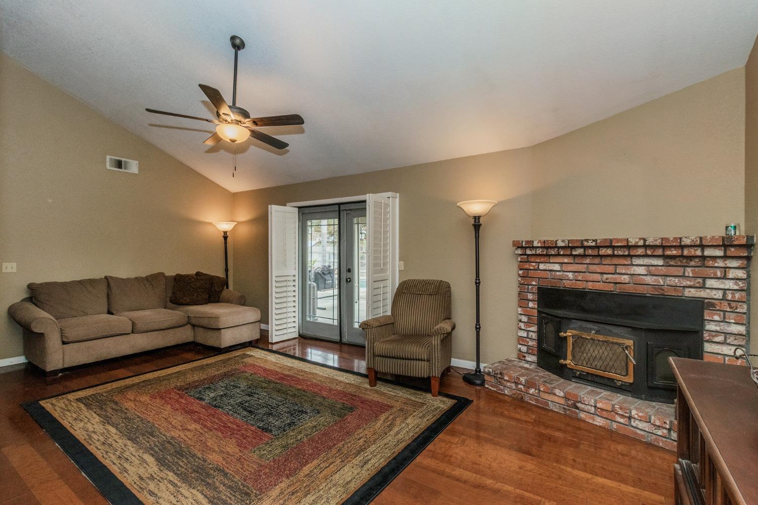 3440 Olive Street Selma, CA 93662 - Photo 5 of 21 a living room with furniture and a fireplace