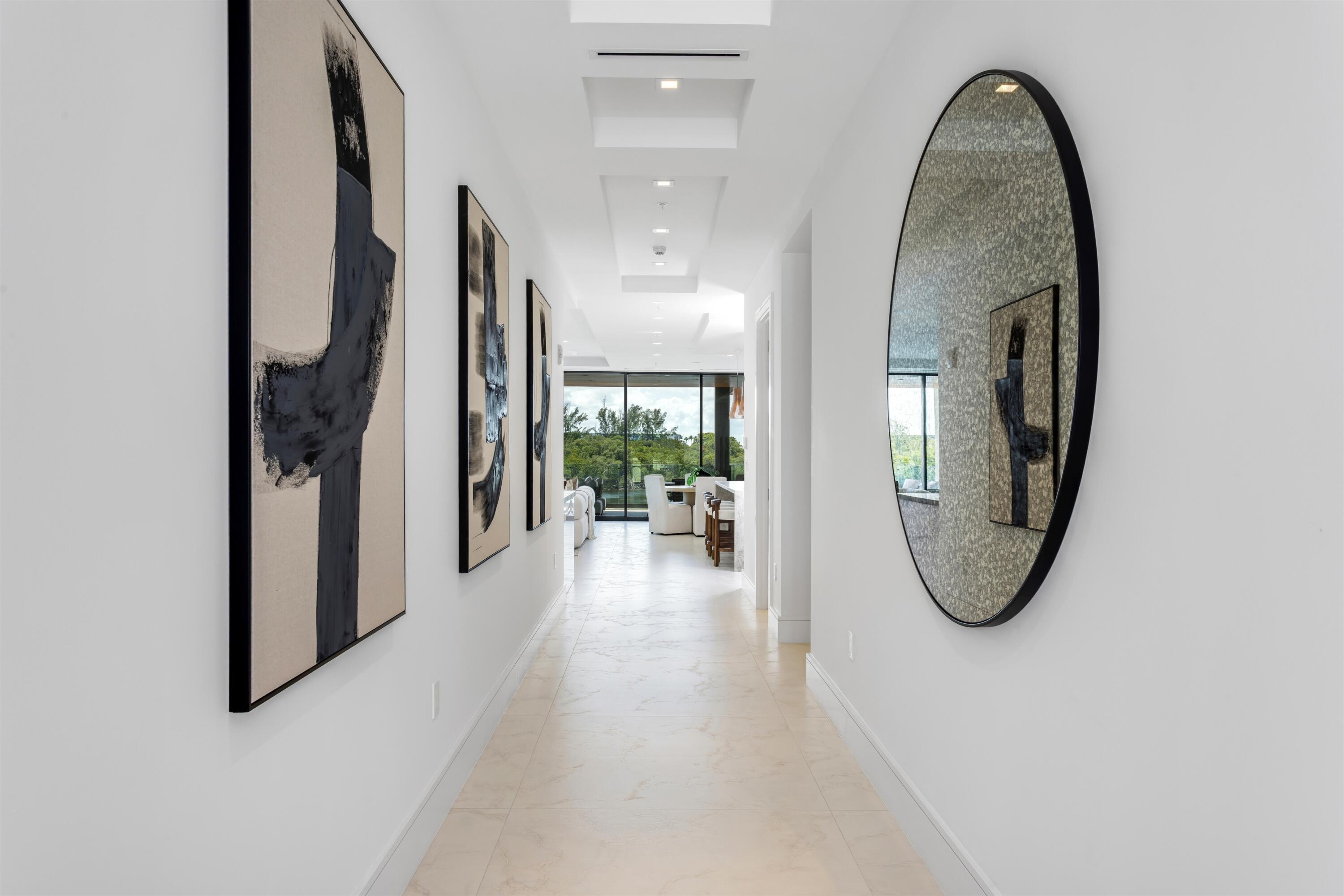 900 Lago Mar Lane, Unit PH Boca Raton, FL 33431 - Photo 19 of 58 a view of a livingroom with furniture and a potted plant
