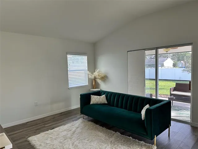 a living room with furniture and a window