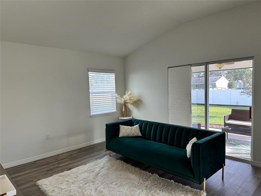 1099 Dania Circle Palm Bay, FL 32905 - Photo 6 of 17 a living room with furniture and a window