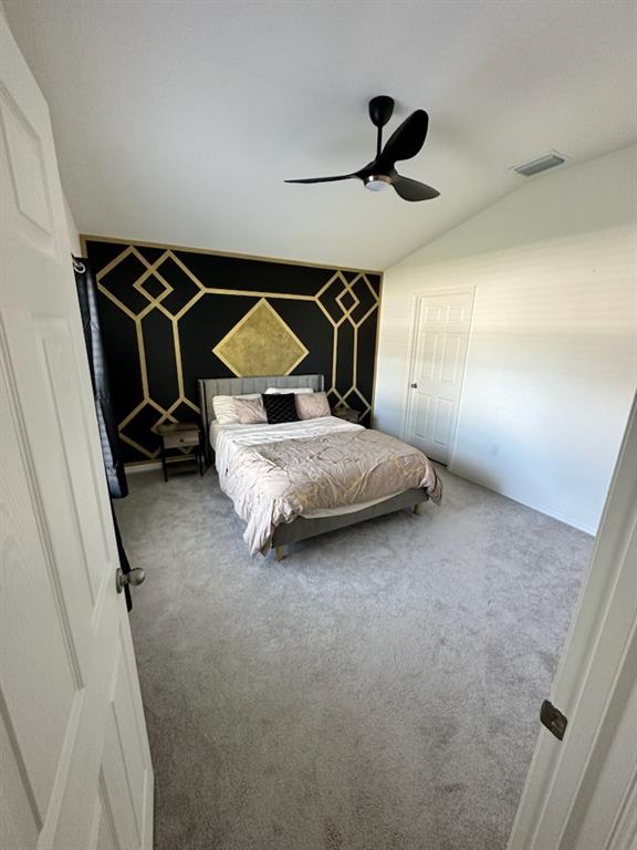 1099 Dania Circle Palm Bay, FL 32905 - Photo 8 of 17 a bedroom with a bed and a ceiling fan