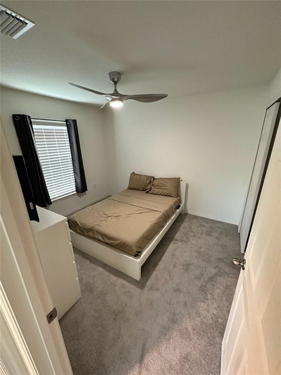 1099 Dania Circle Palm Bay, FL 32905 - Photo 10 of 17 a bedroom with a bed and a flat screen tv