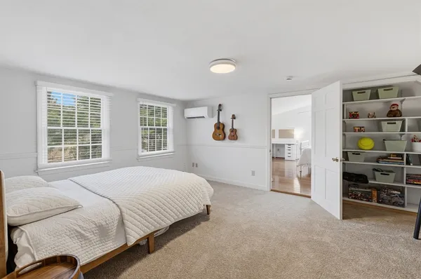 a bedroom with a bed and a cabinets