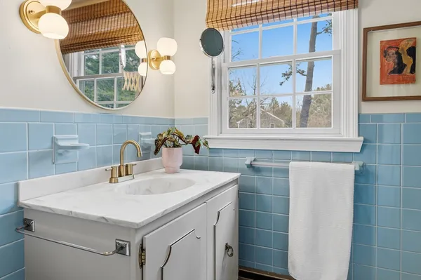 a bathroom with a sink and a mirror