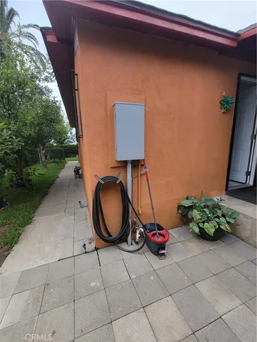 a view of a room with swing and potted plants