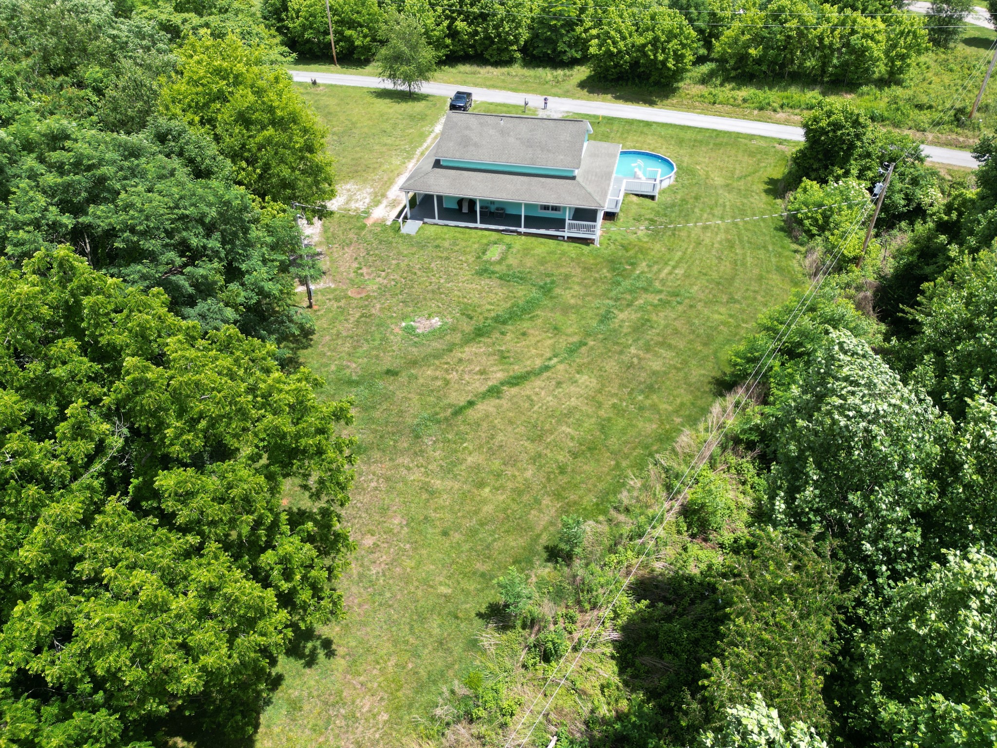581 Shady Grove Road Bloomington Springs, TN 38545 - Photo 35 of 42 an aerial view of a house with pool yard outdoor seating and yard
