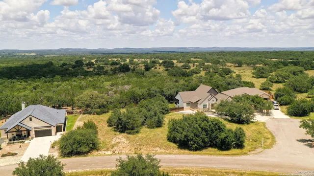an aerial view of a house with a garden