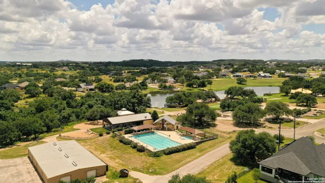 an aerial view of a house with lake view